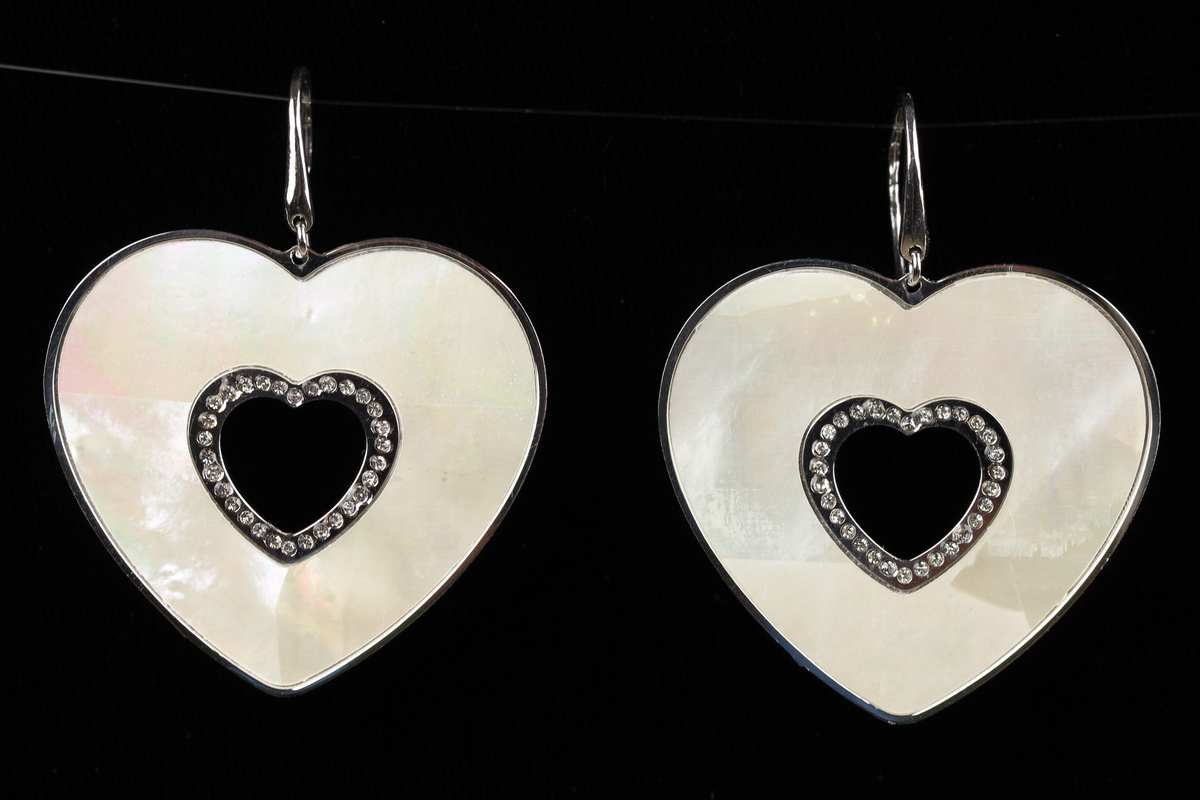 Elegant earrings with a big heart shaped pendant