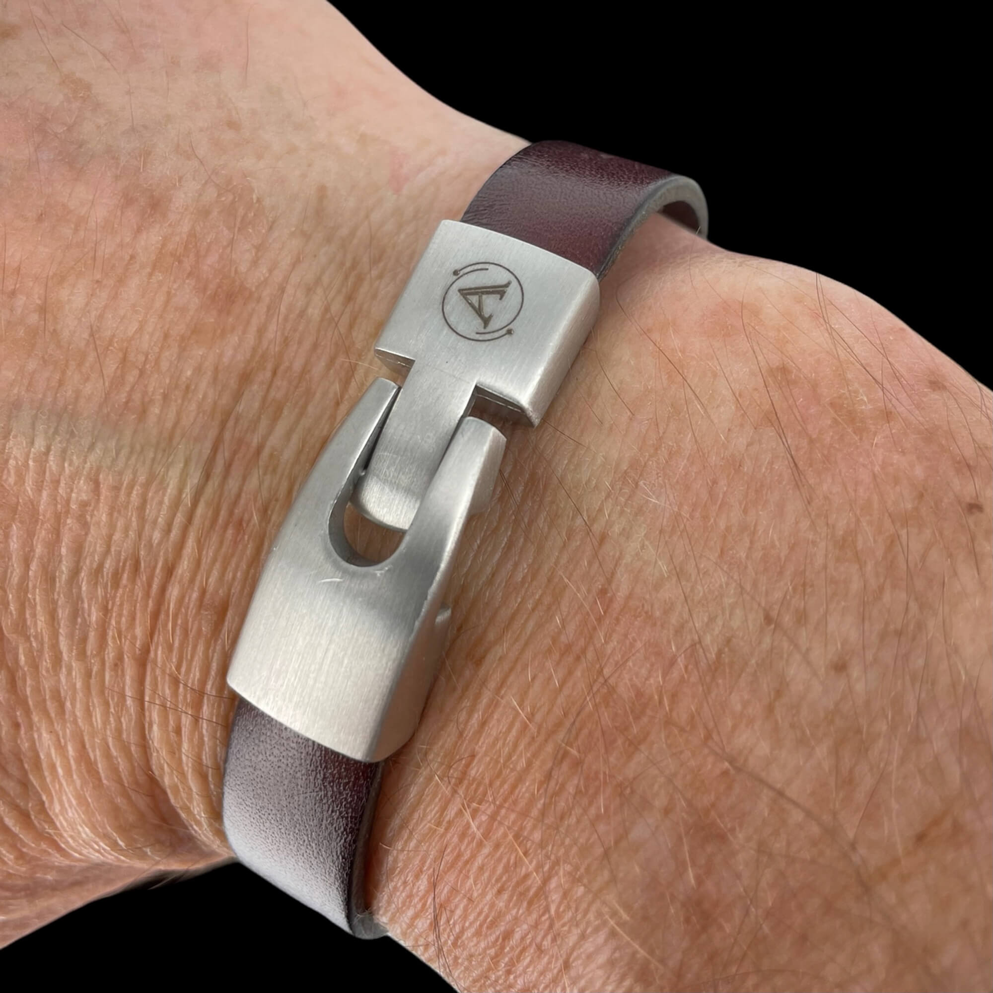 Brown leather bracelet with gray-colored stainless steel links