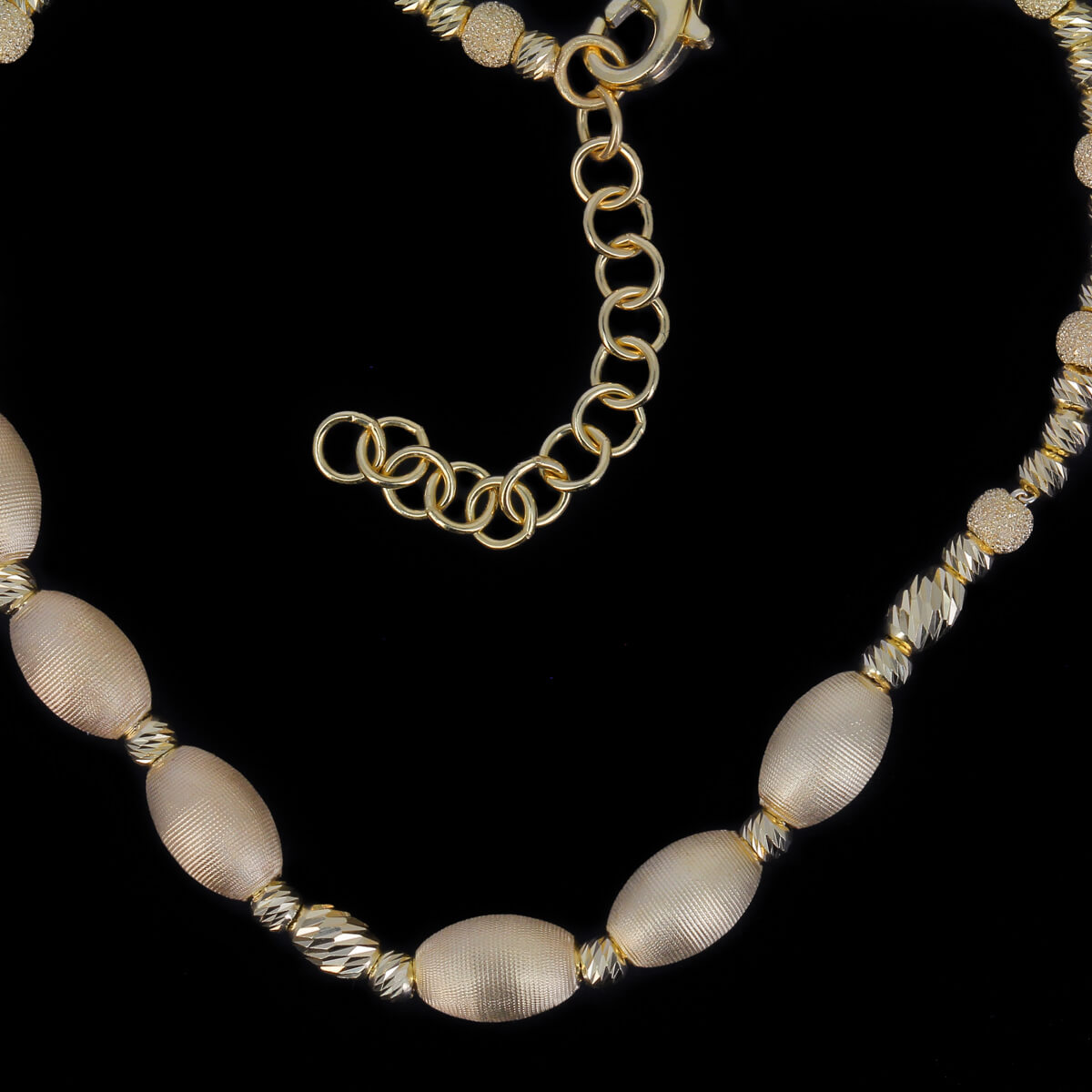 Beautiful gold-plated necklace with matte oval balls