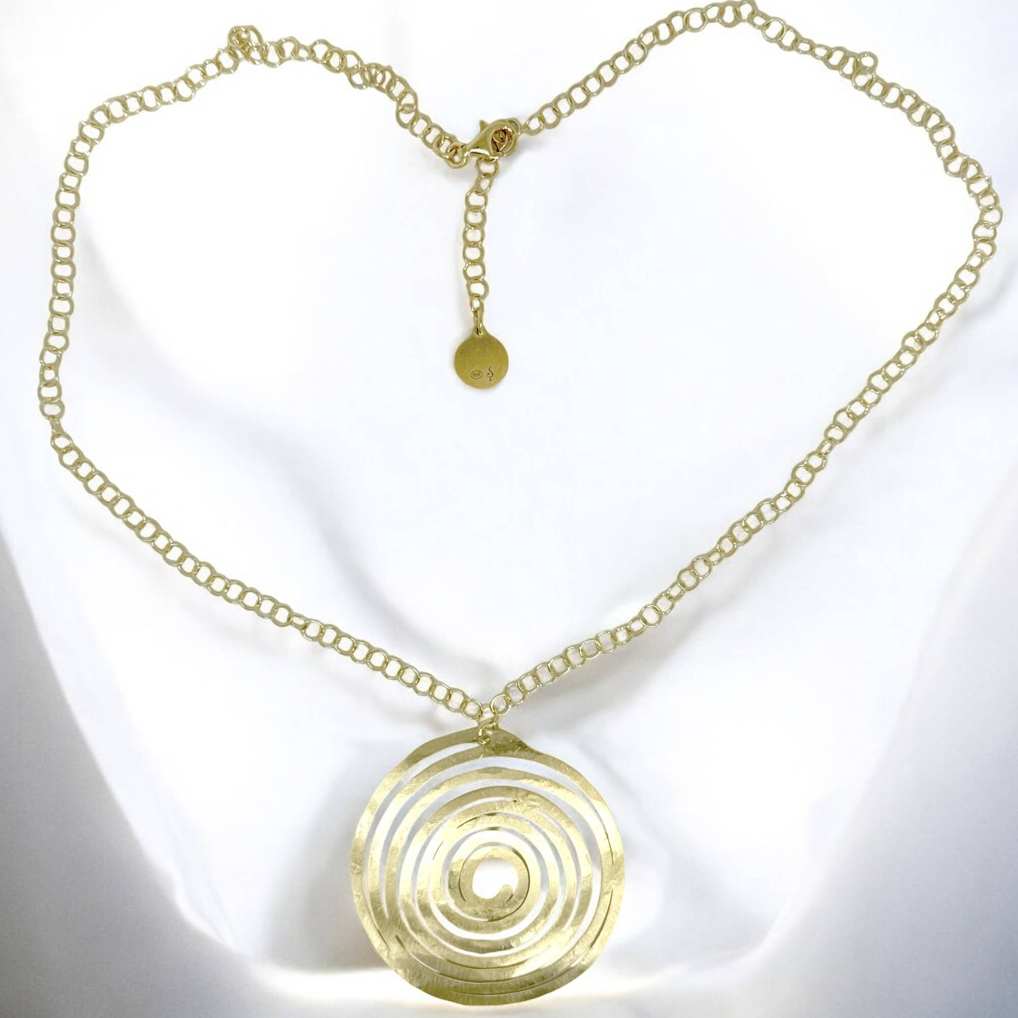 Circular gold plated pendant with chain