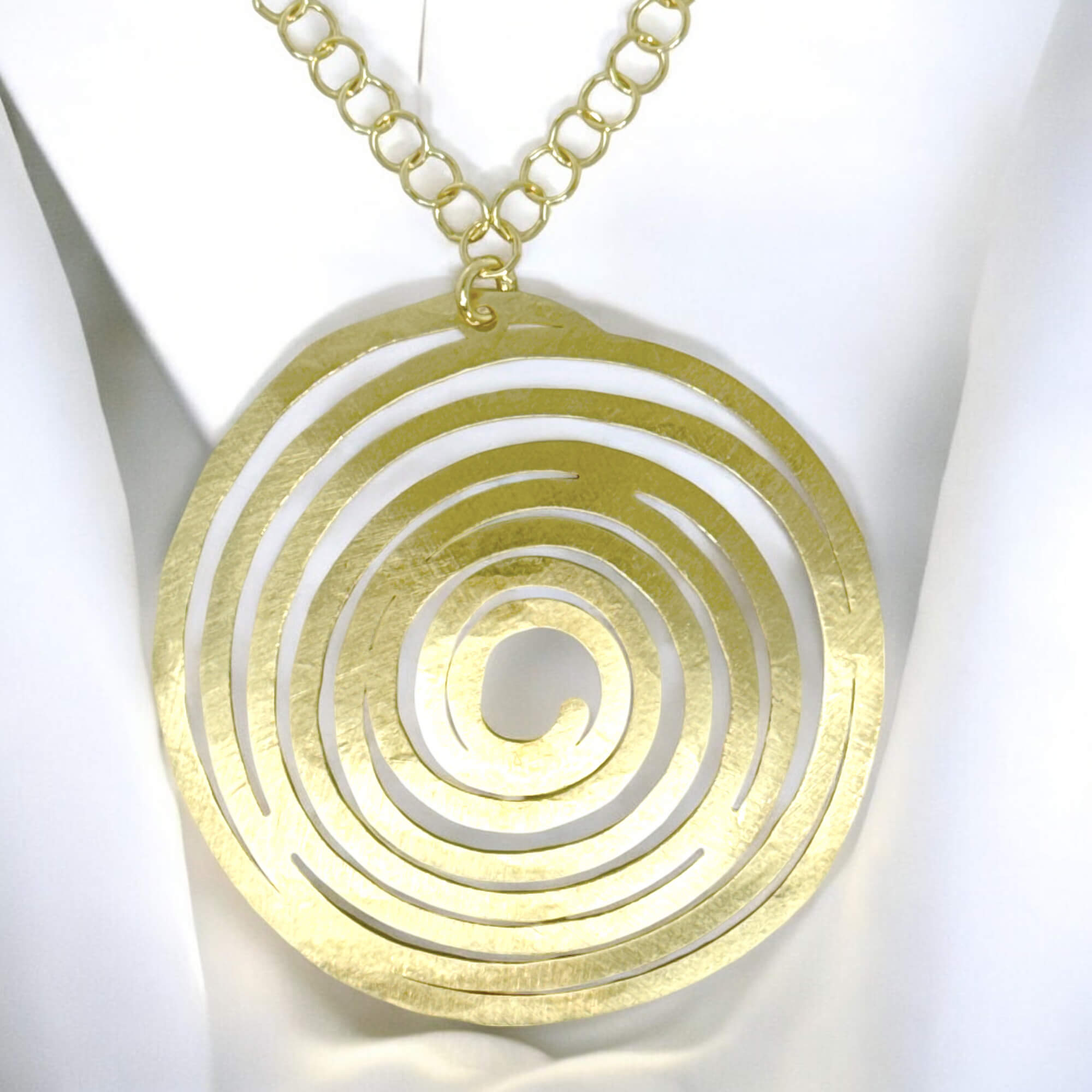 Circular gold plated pendant with chain