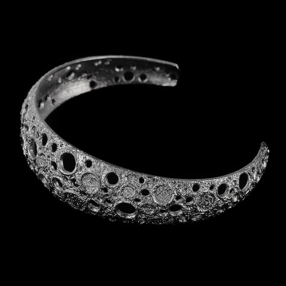 Narrow gray and silver bracelet with machined flare