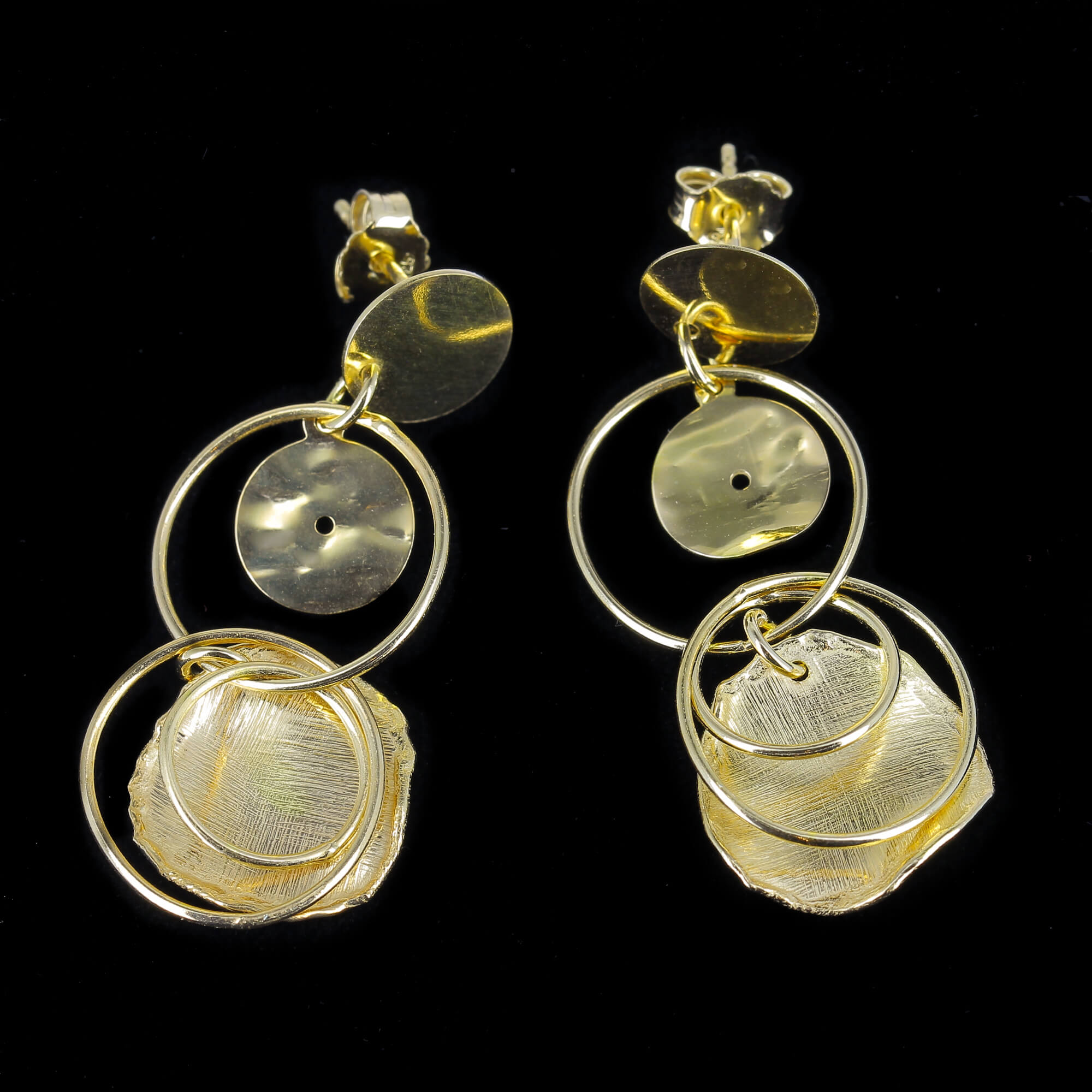 Open and closed round gilded shift earrings