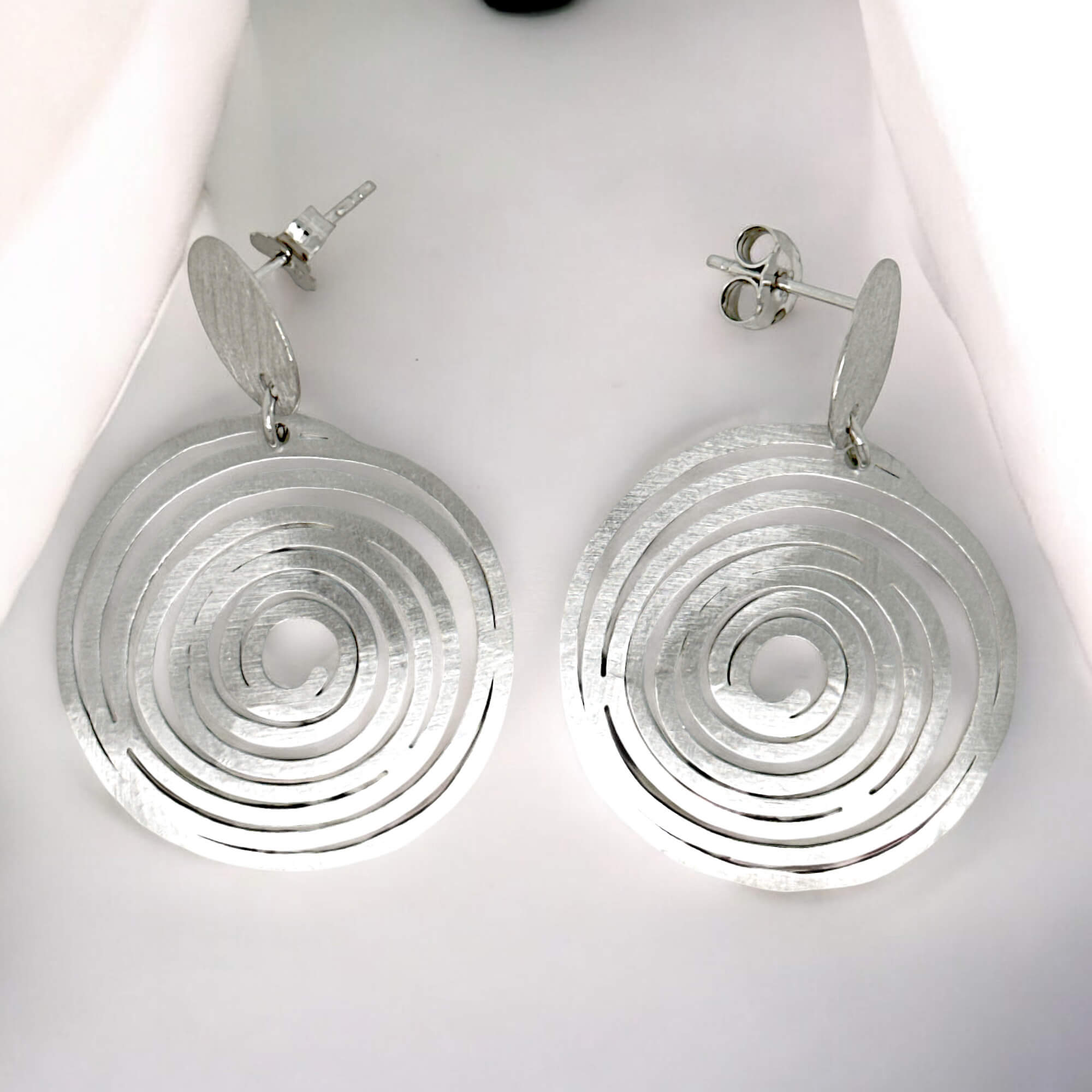 Circular silver earrings