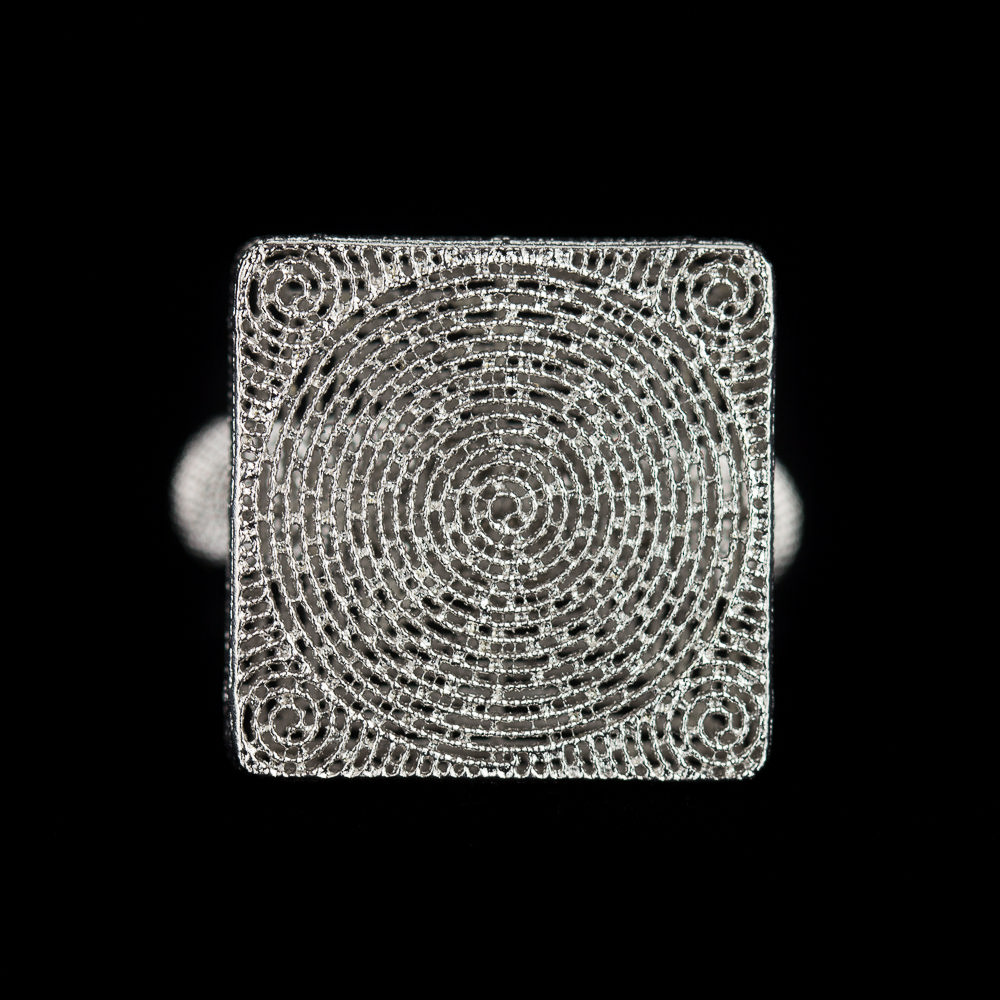 Finely worked out square ring of silver