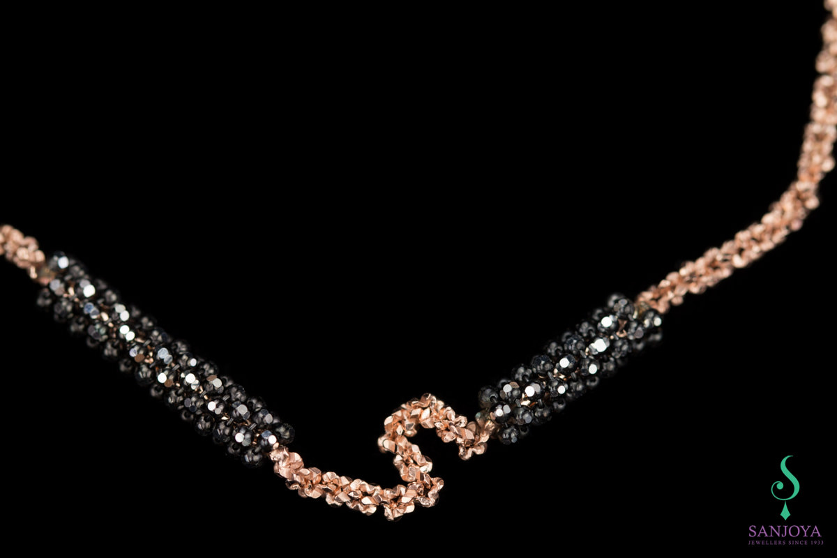 OX0416004 - Rosé armband met zwarte versiering