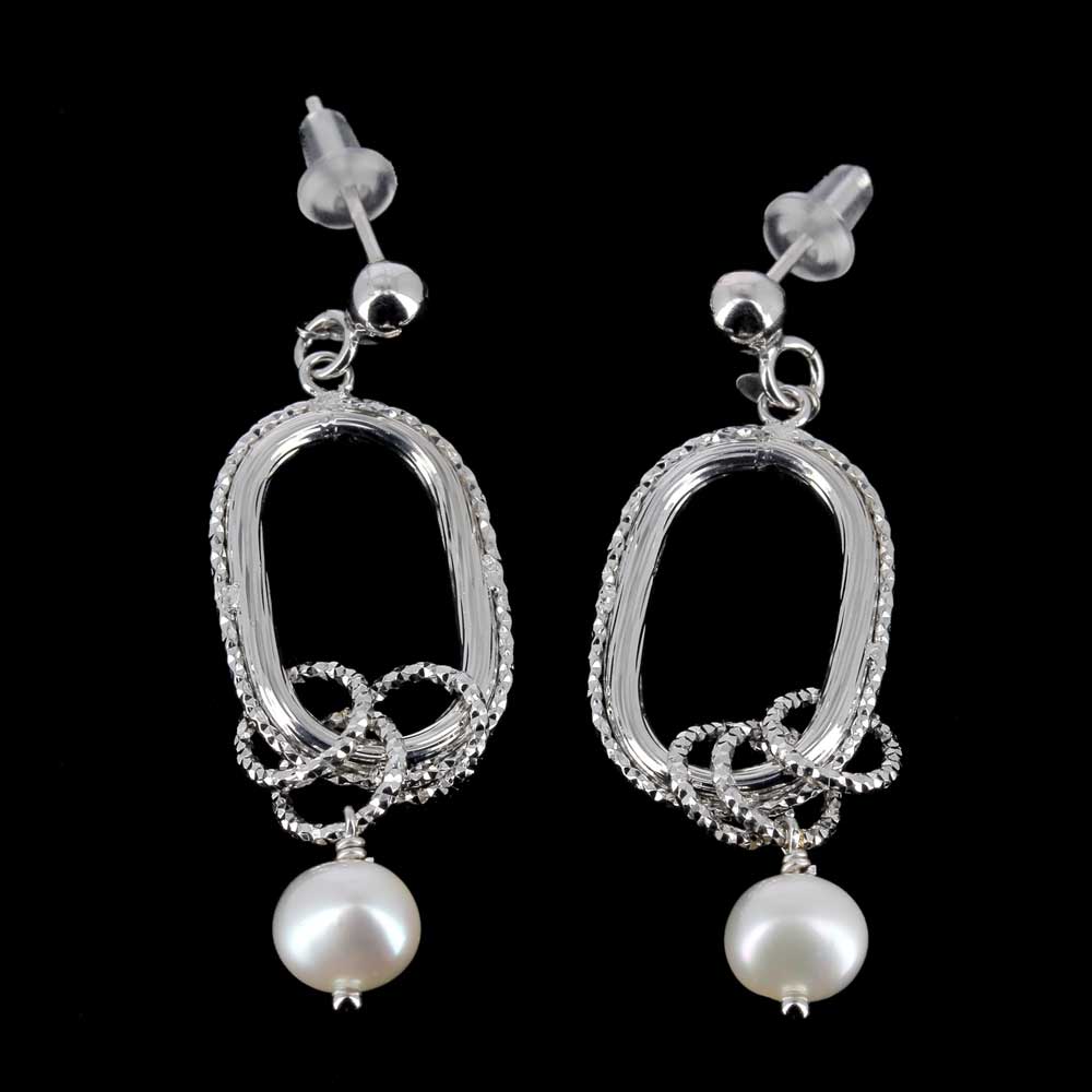 Crafted silver earrings with pearl