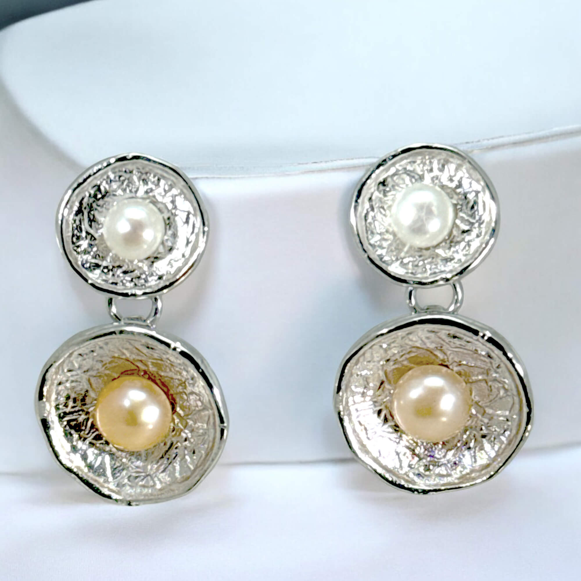 Short hanging silver earrings with two pearls