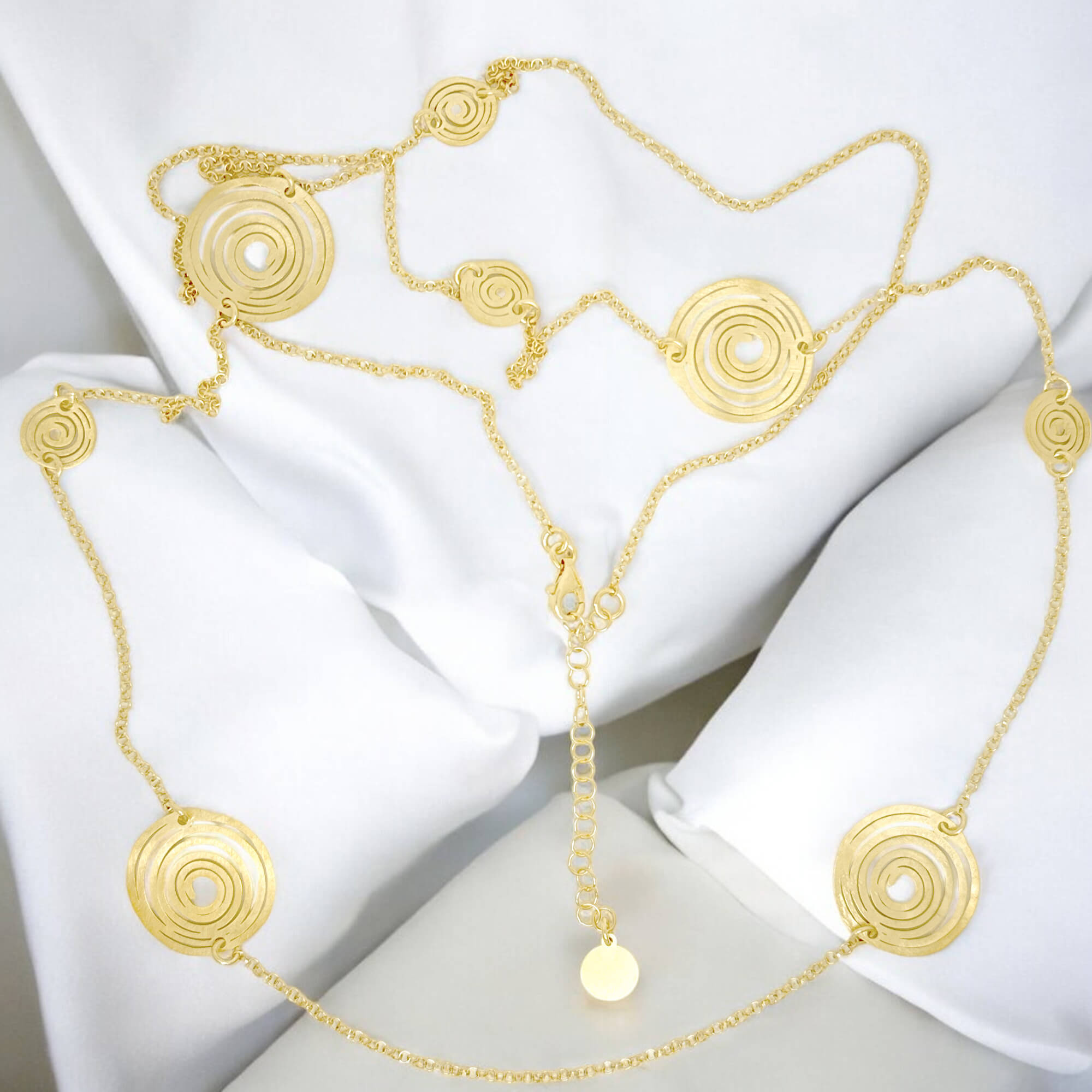 Long gold plated necklace with decorated circles