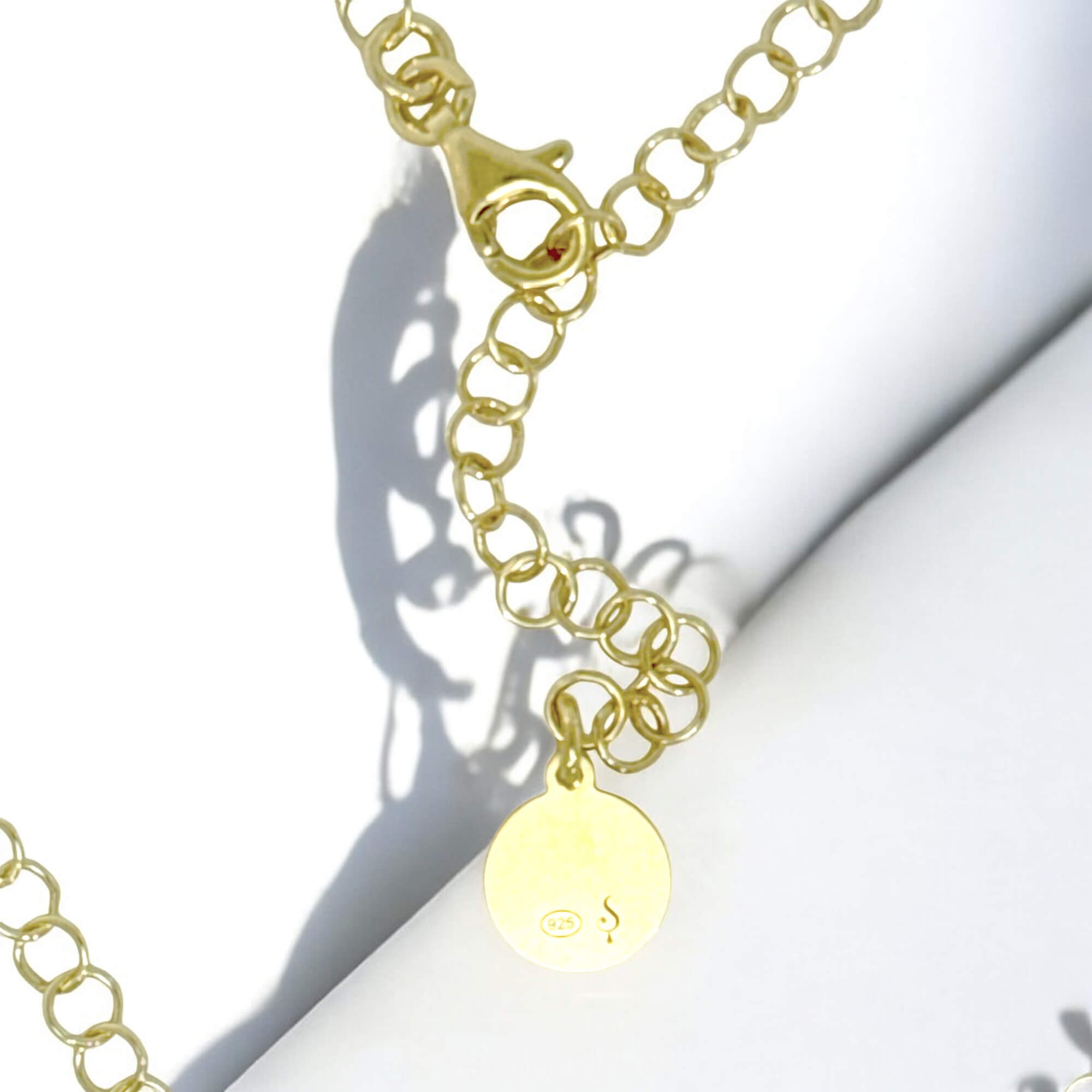 Long gold plated necklace with decorated circles