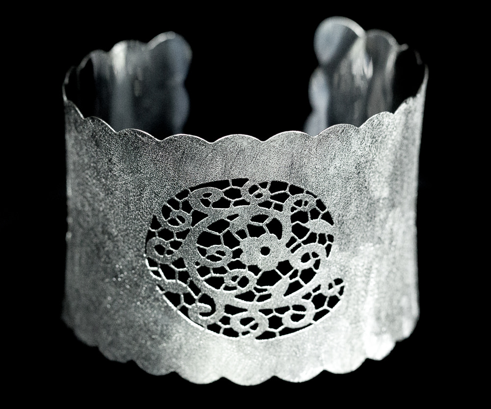 Italian cuff bracelet in sterling silver with lacy ornament centre