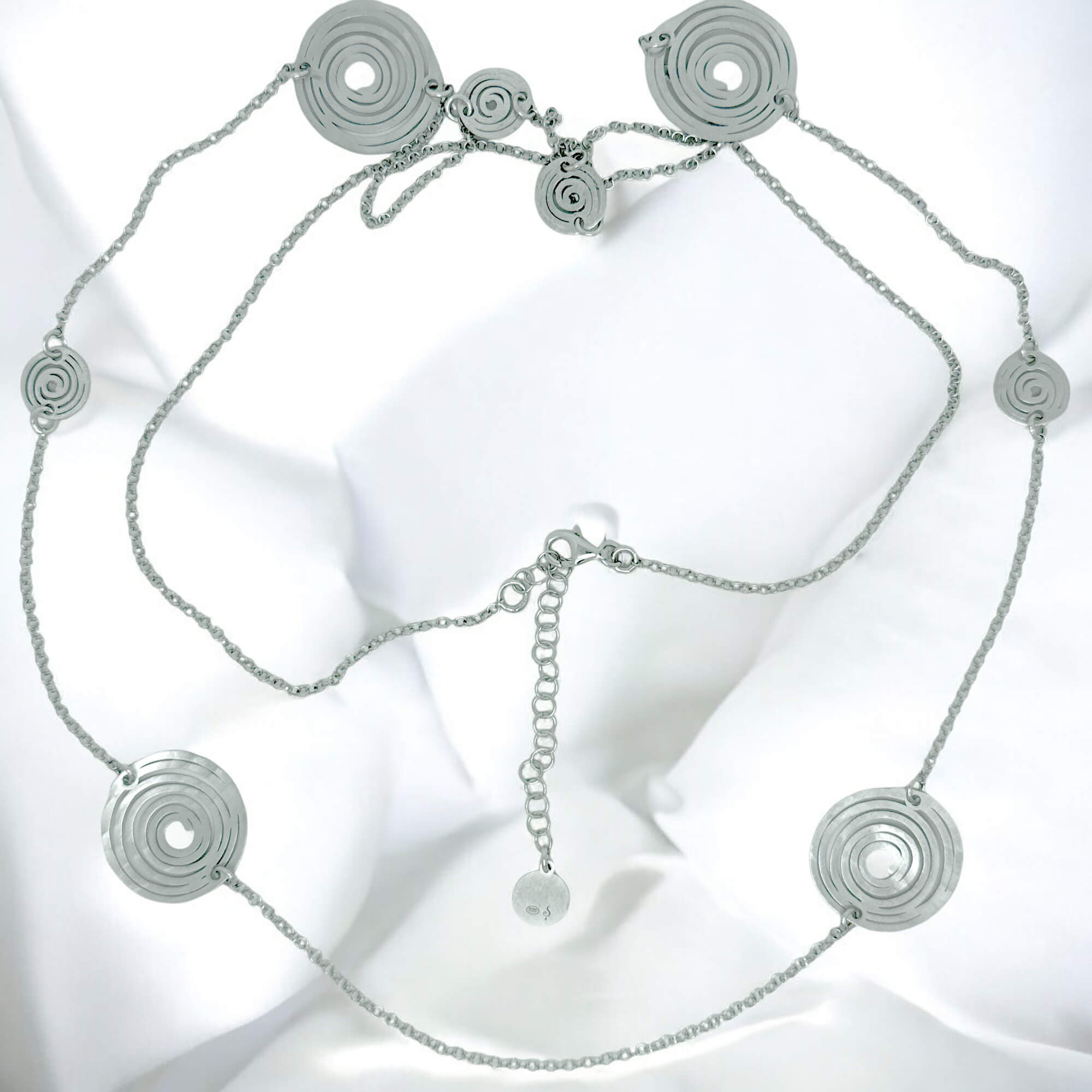 Long silver necklace with decorated circles