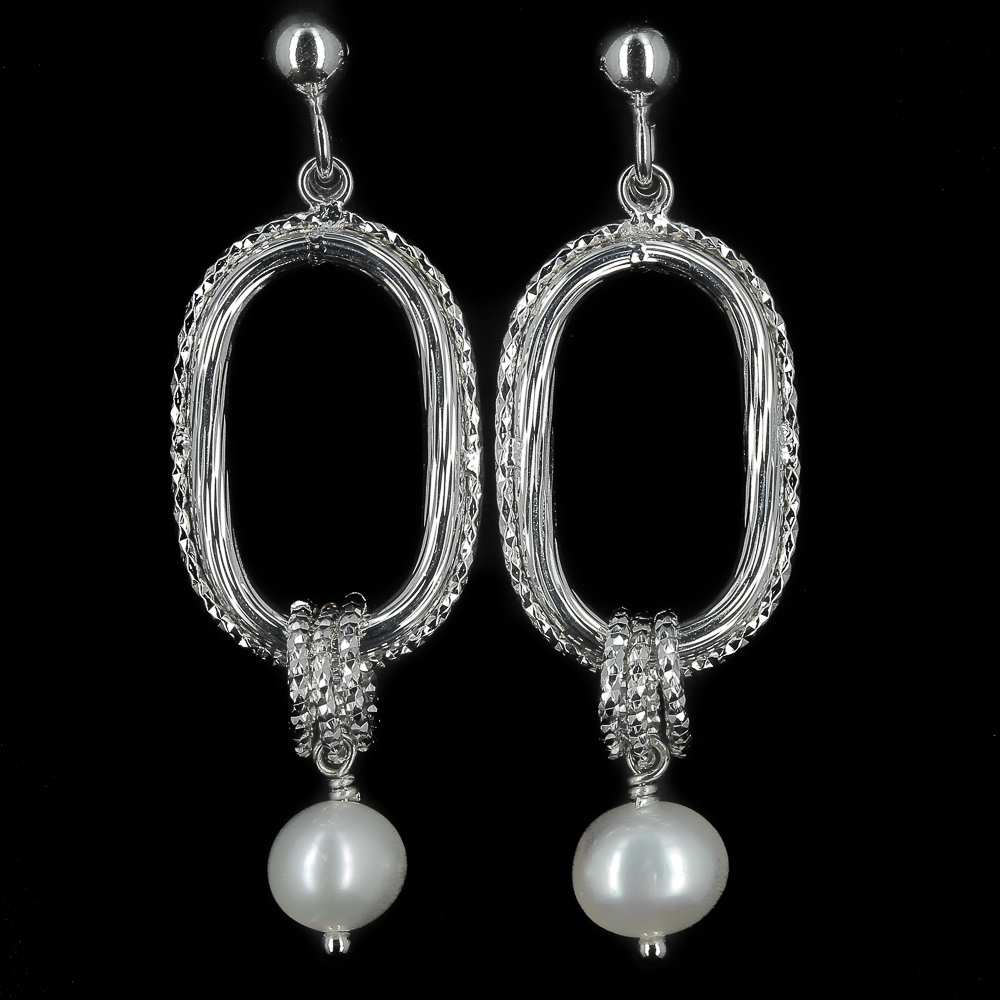 Crafted silver earrings with pearl