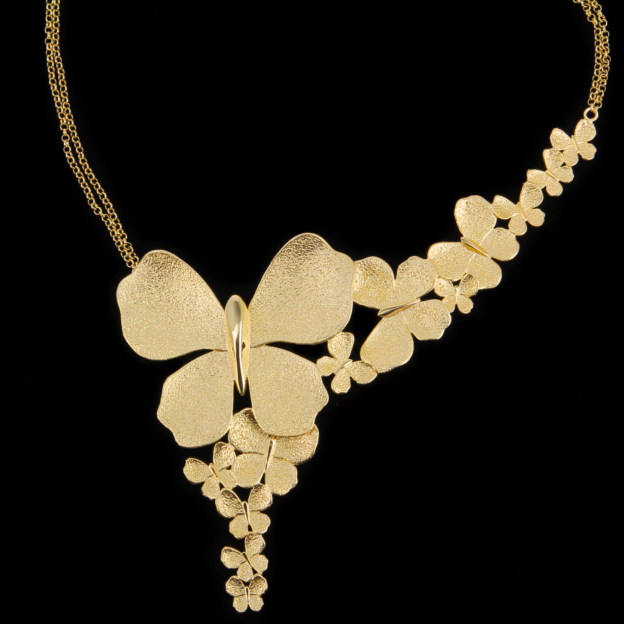 Gold plated necklace with a few butterflies