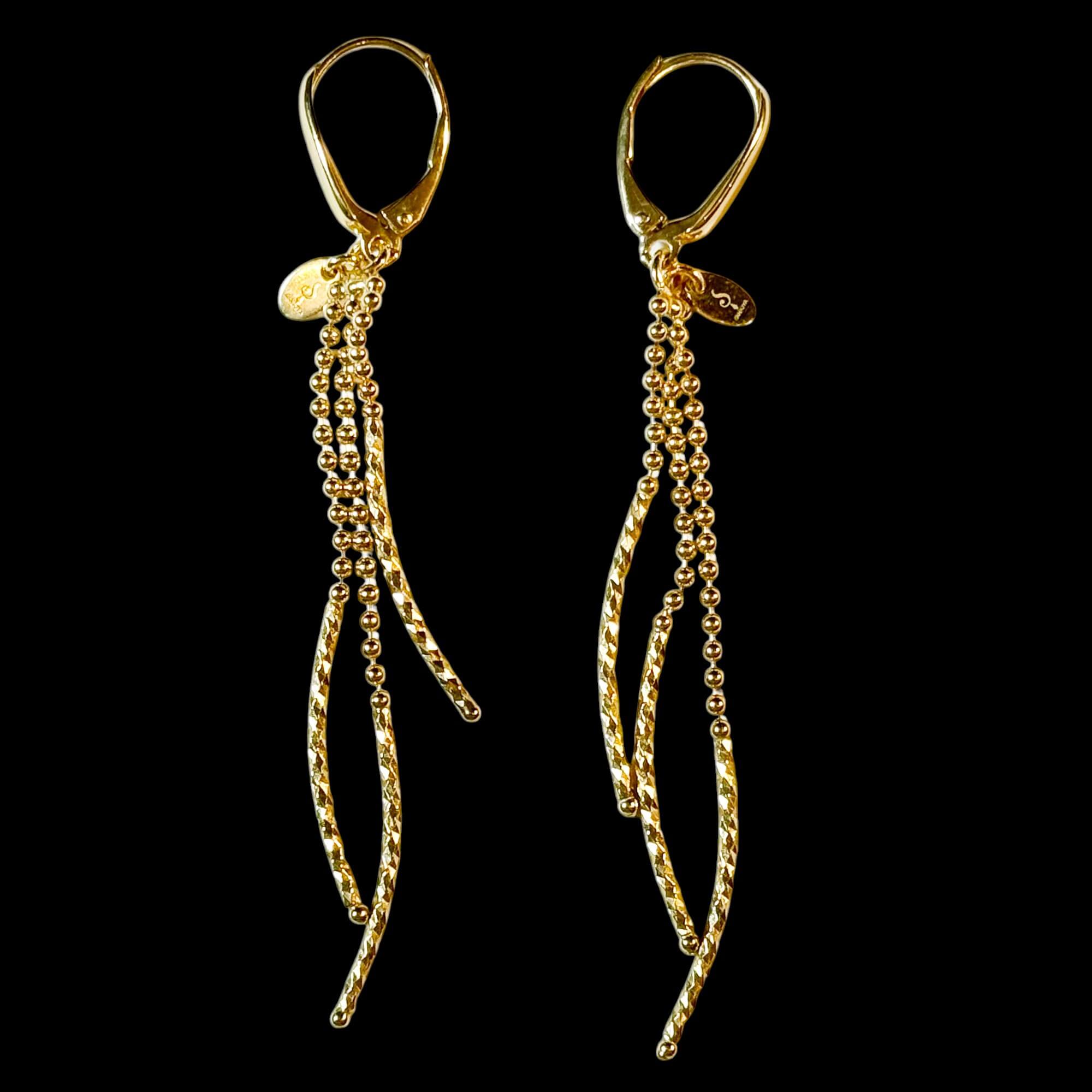 Longues boucles d’oreilles dorées pendantes à trois rangs