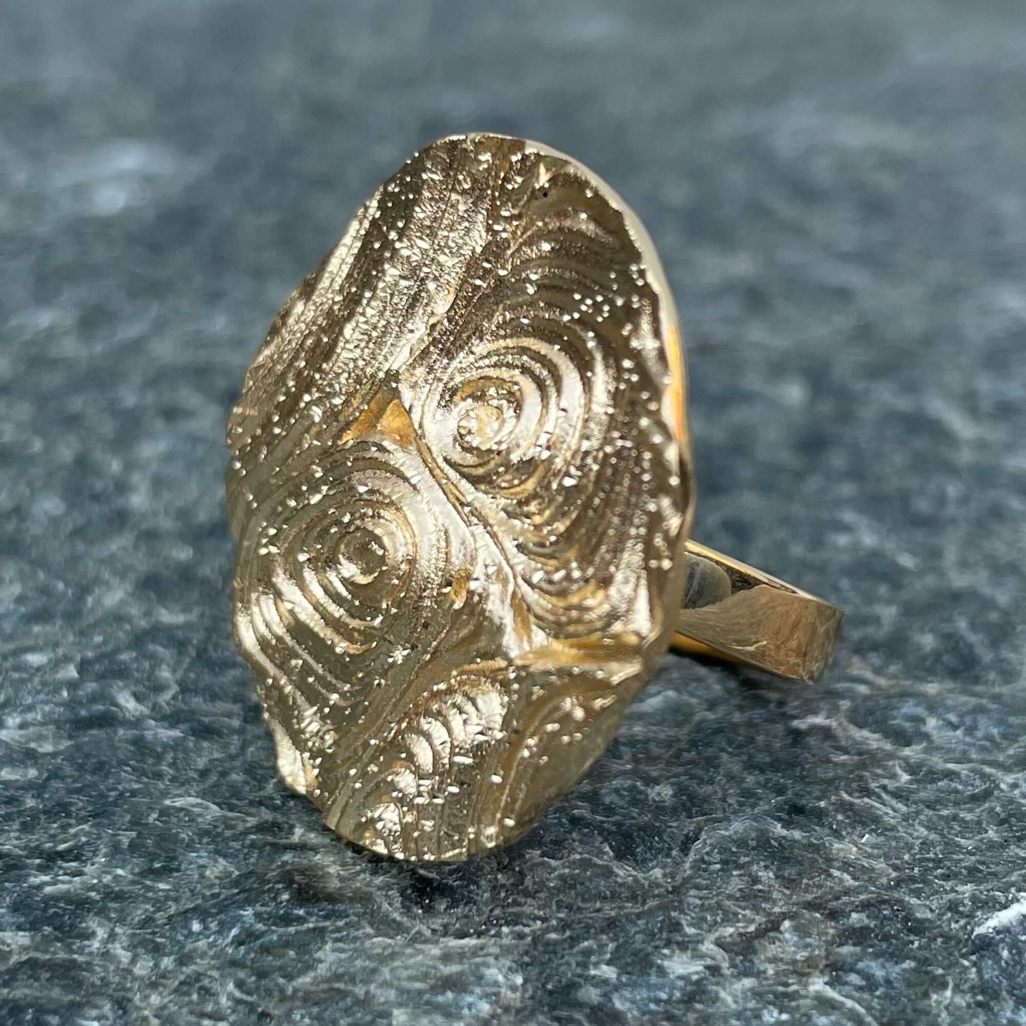 Created round ring made of gold-plated silver