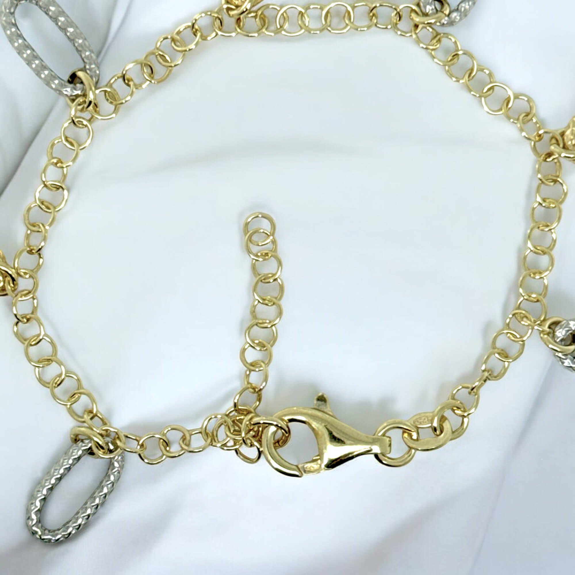 Decorated gold-plated bracelet with two-tone pendants