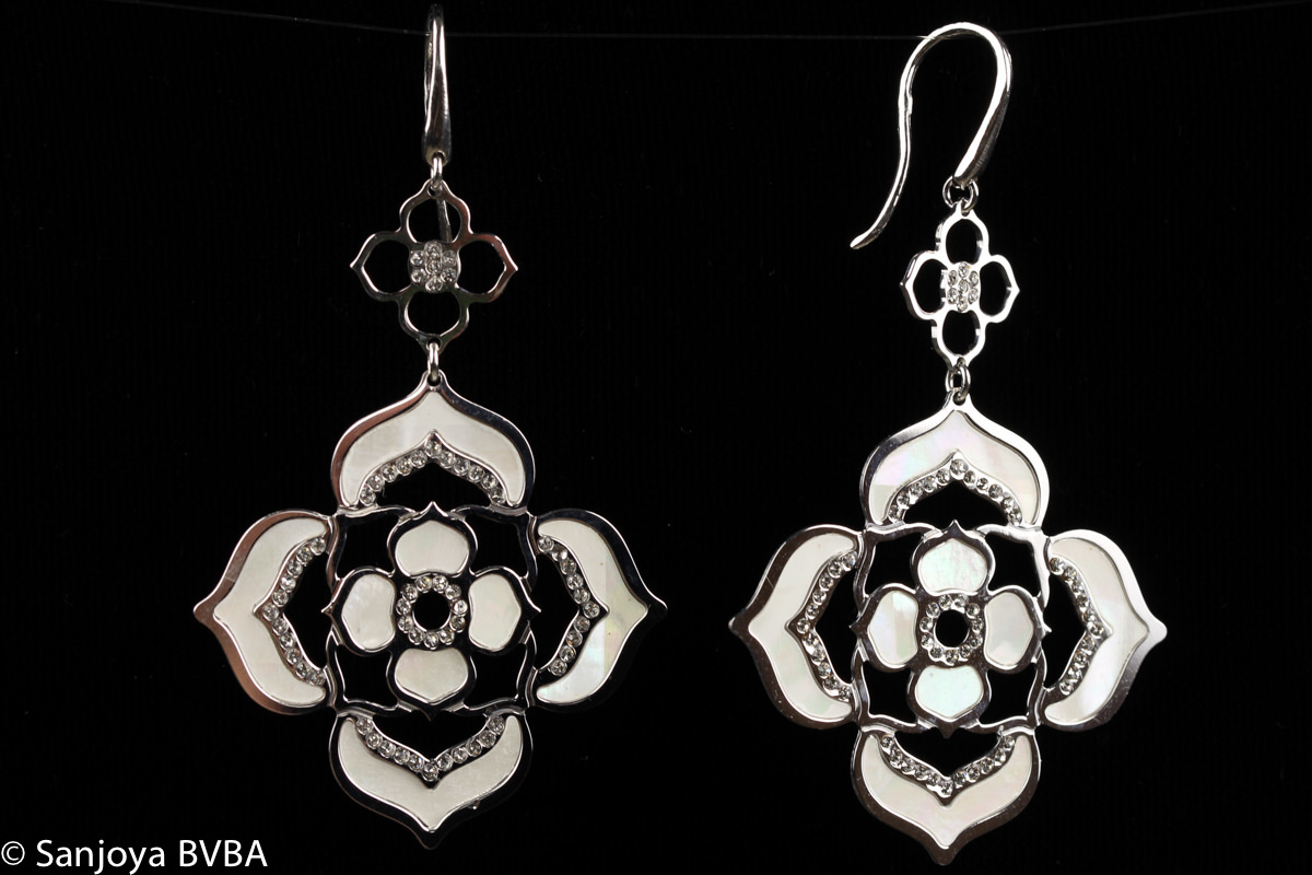 Floral designed silver earrings with decorations