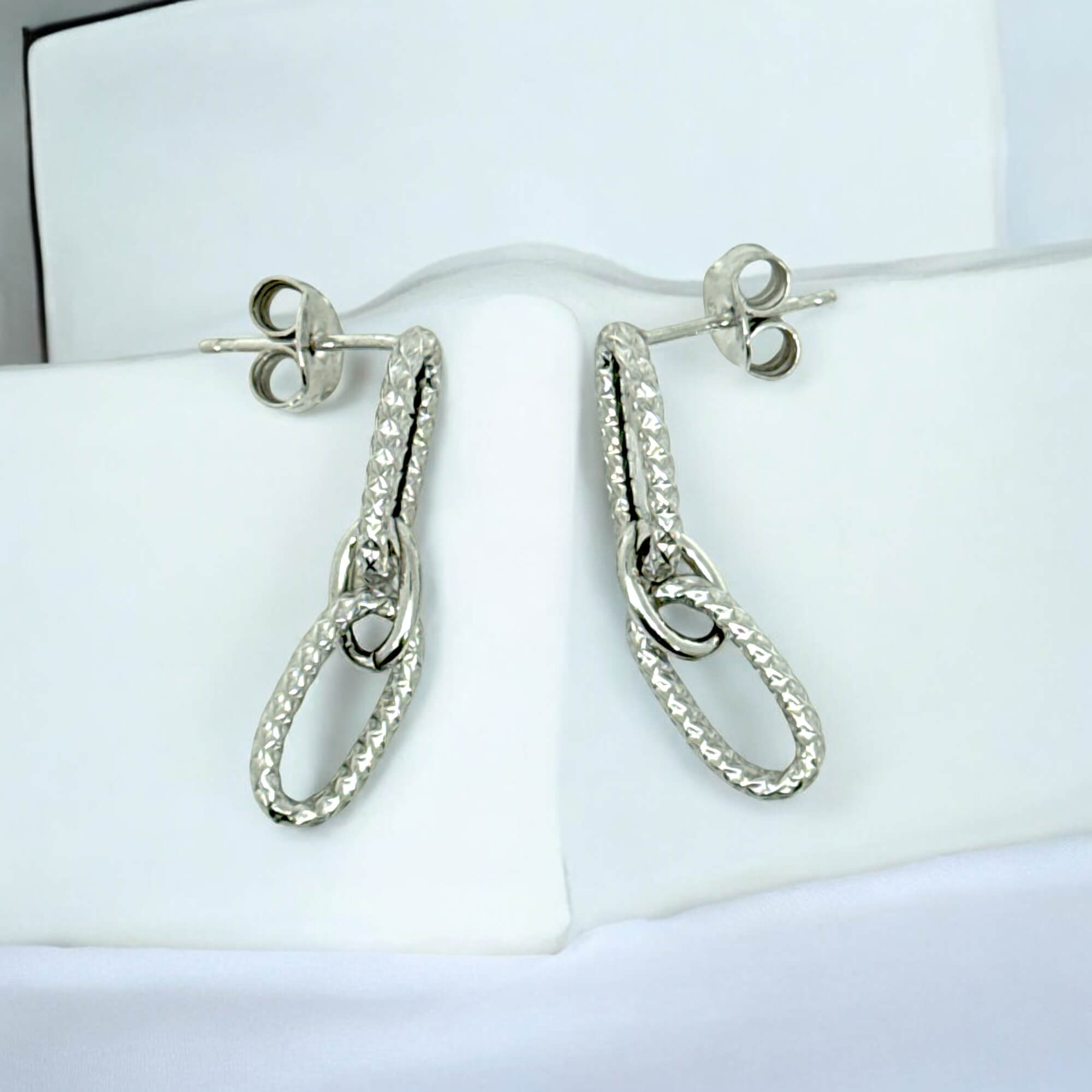 Decorated silver earrings with two oval pendants