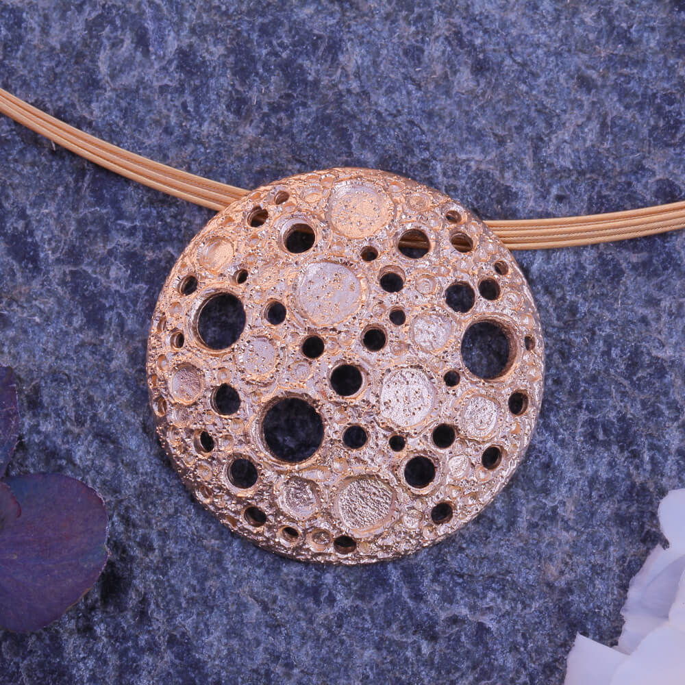 Rosé pendant with irregular beautiful holes