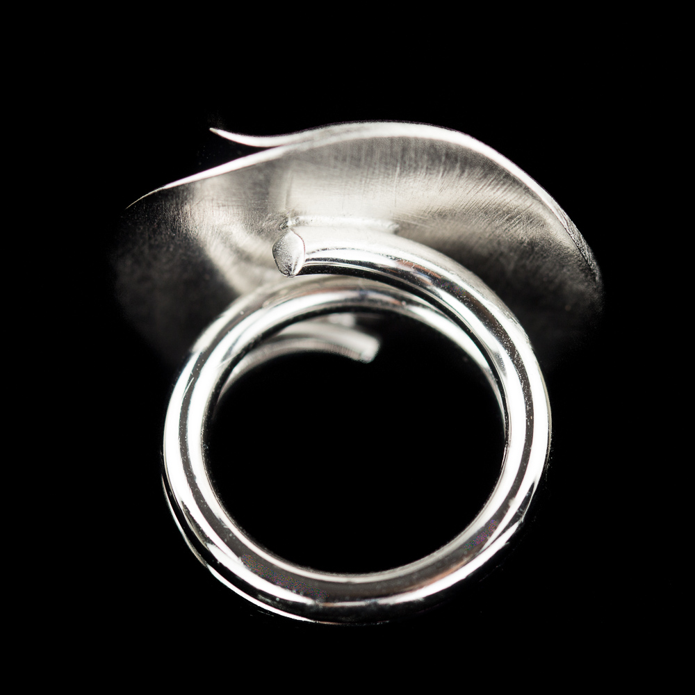Silver circular ring with polished curl