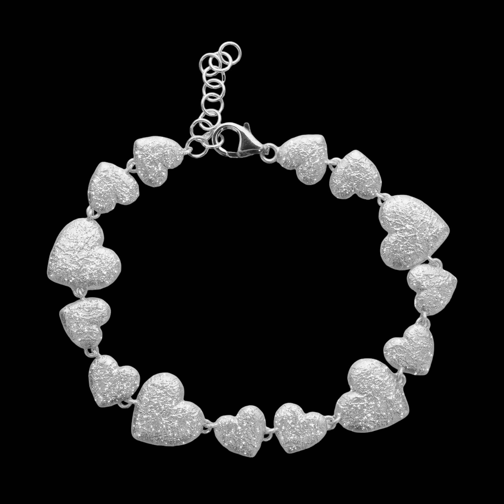 Silver bracelet with multiple hearts