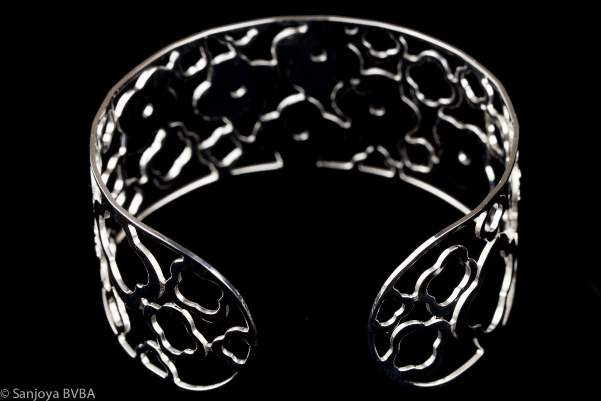 Silver cuff bracelet with mother-of-pearl flower design